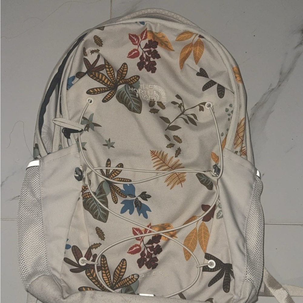 The North Face Women's Backpack - Cream with Multicolor Leaf Pattern